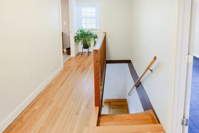 a spacious bedroom with a bed and a cabinets