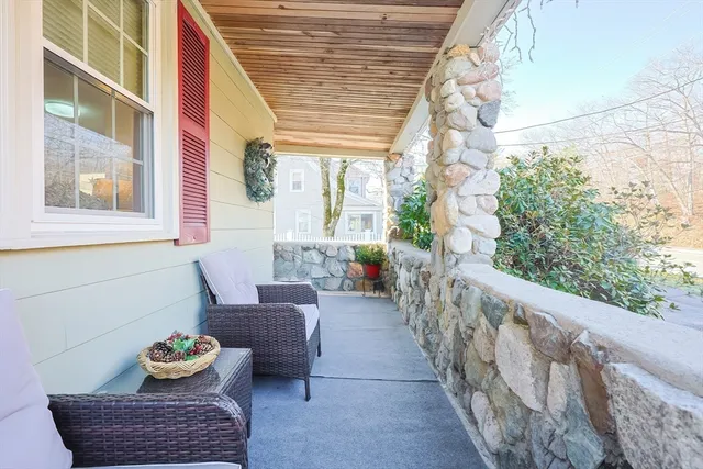 a living room with furniture and next to a window