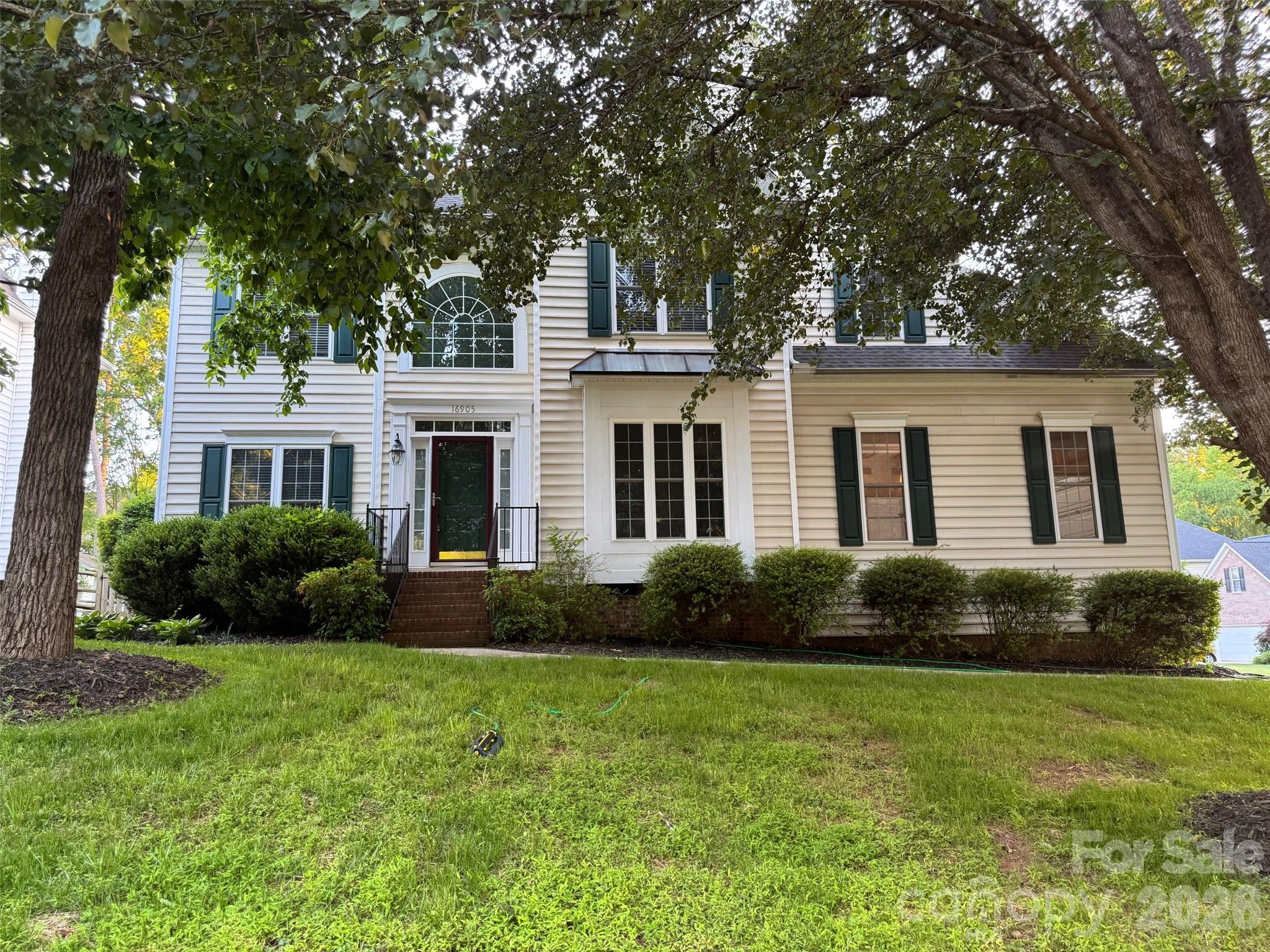 16905 Laureate Road, Unit 16 Huntersville, NC 28078 - Photo 1 of 38 a view of a house with garden and yard