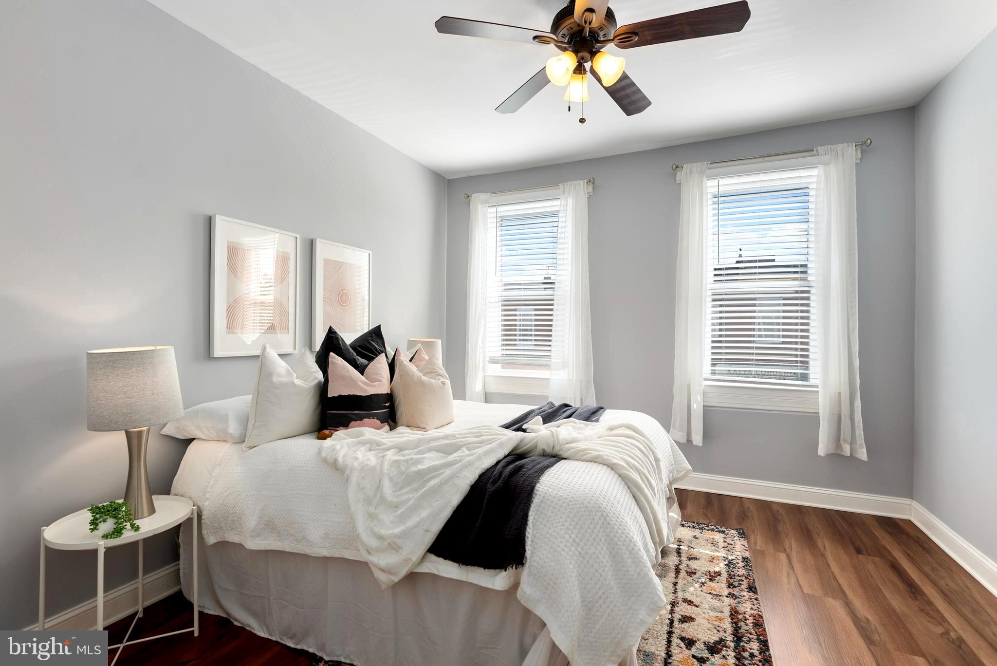 280 South Robinson Street Baltimore, MD 21224 - Photo 19 of 40 a bed room with a bed and a chandelier