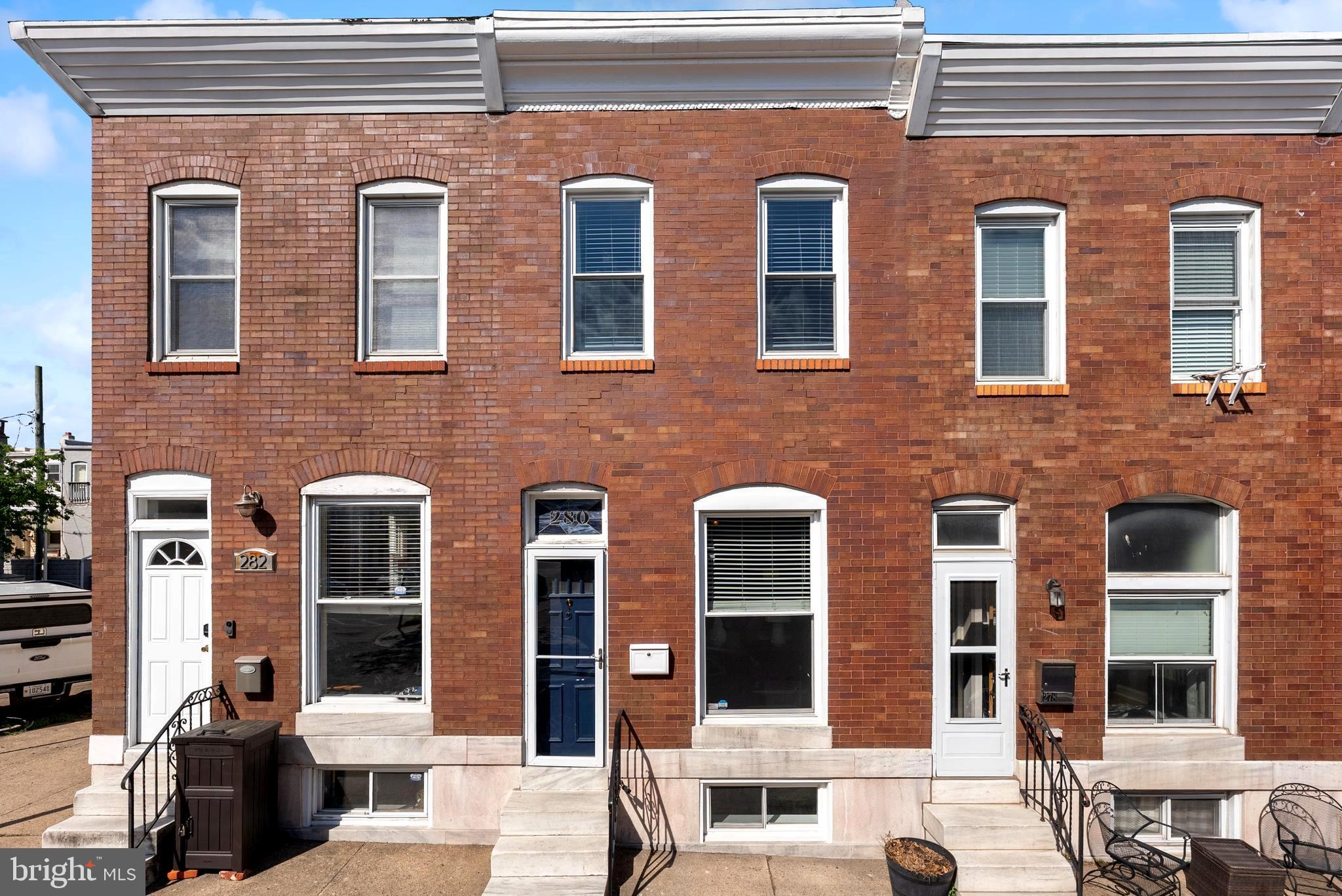 280 South Robinson Street Baltimore, MD 21224 - Photo 2 of 40 a front view of a building with glass windows