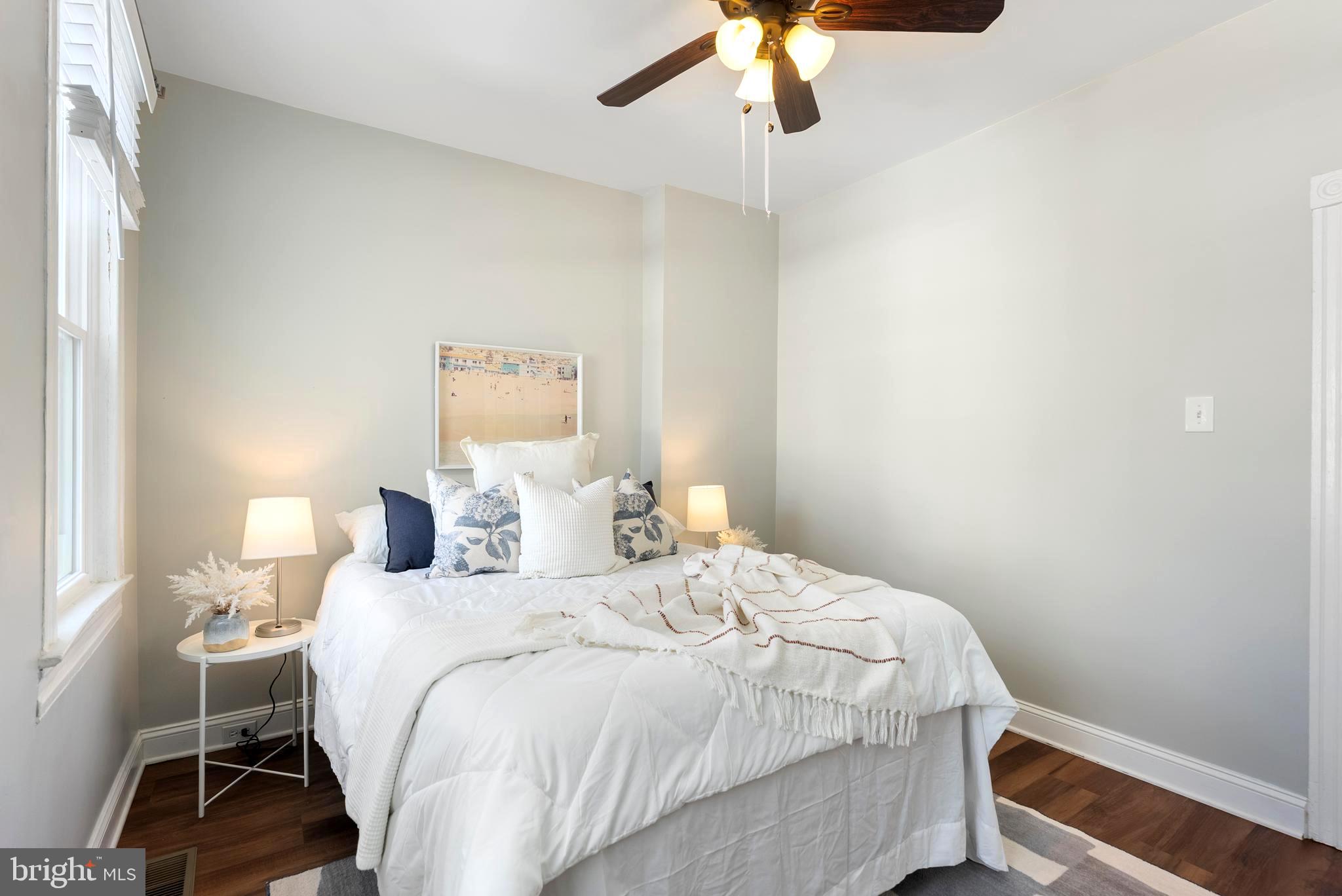 280 South Robinson Street Baltimore, MD 21224 - Photo 28 of 40 a bedroom with a bed and a chair