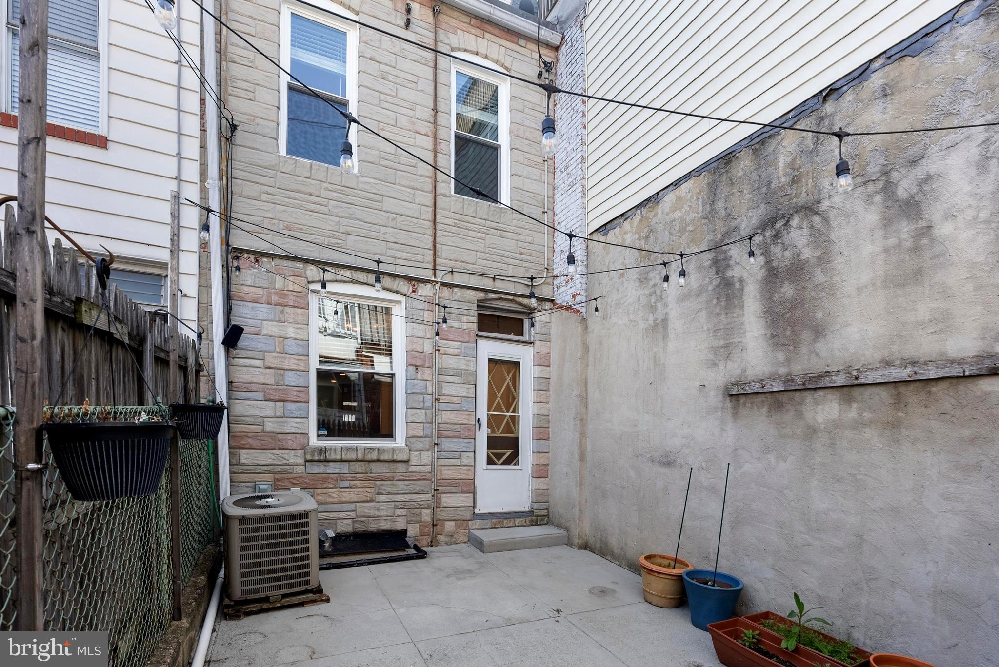 280 South Robinson Street Baltimore, MD 21224 - Photo 36 of 40 a view of a house with a door and a window