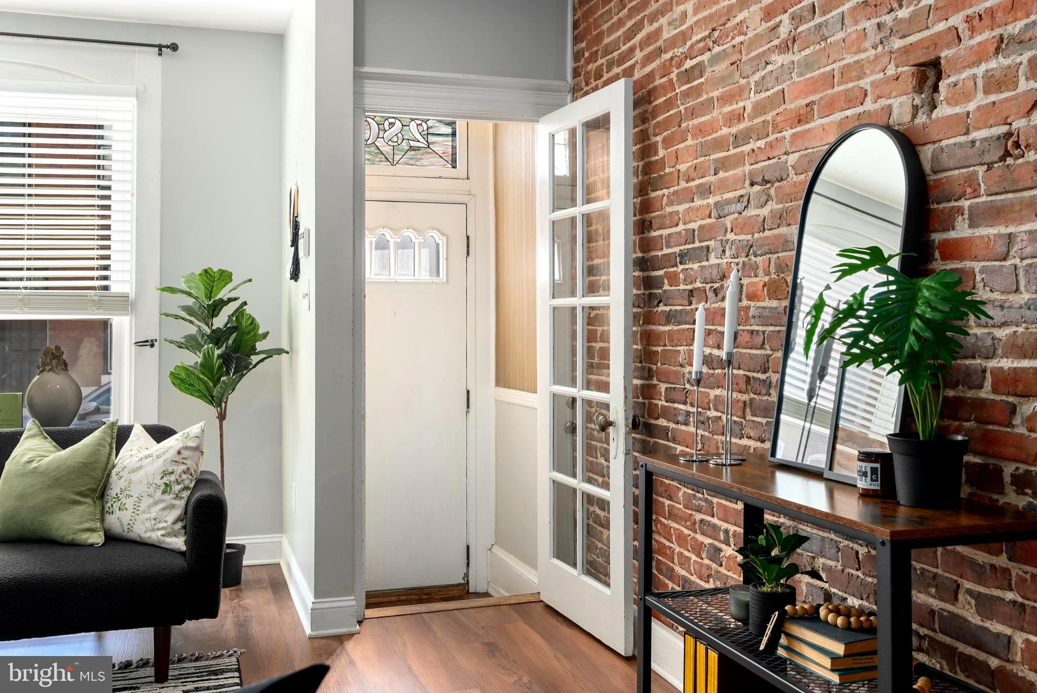 280 South Robinson Street Baltimore, MD 21224 - Photo 4 of 40 a view of entryway with livingroom and wooden floor