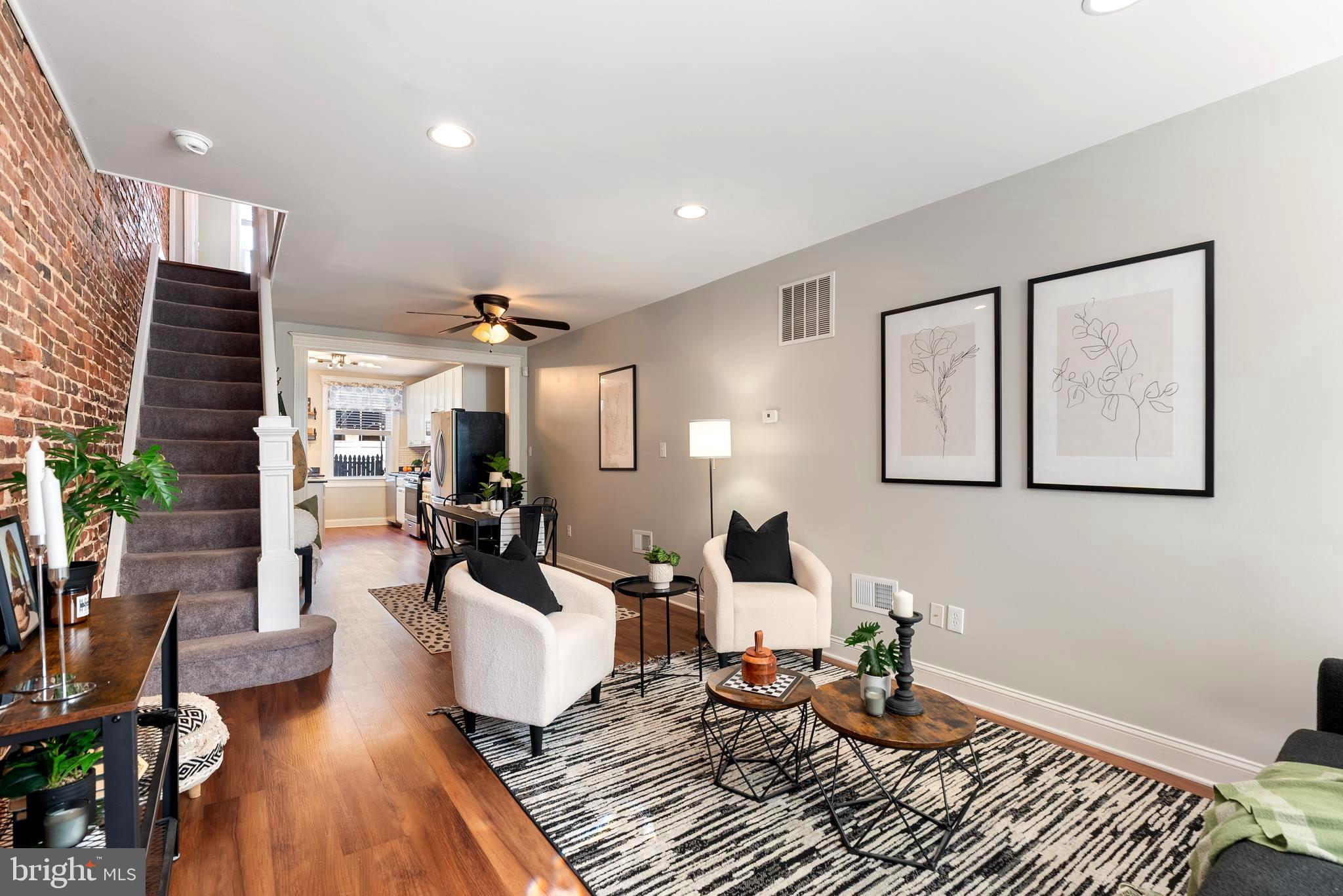 280 South Robinson Street Baltimore, MD 21224 - Photo 6 of 40 a living room with furniture or couch and a wooden floor