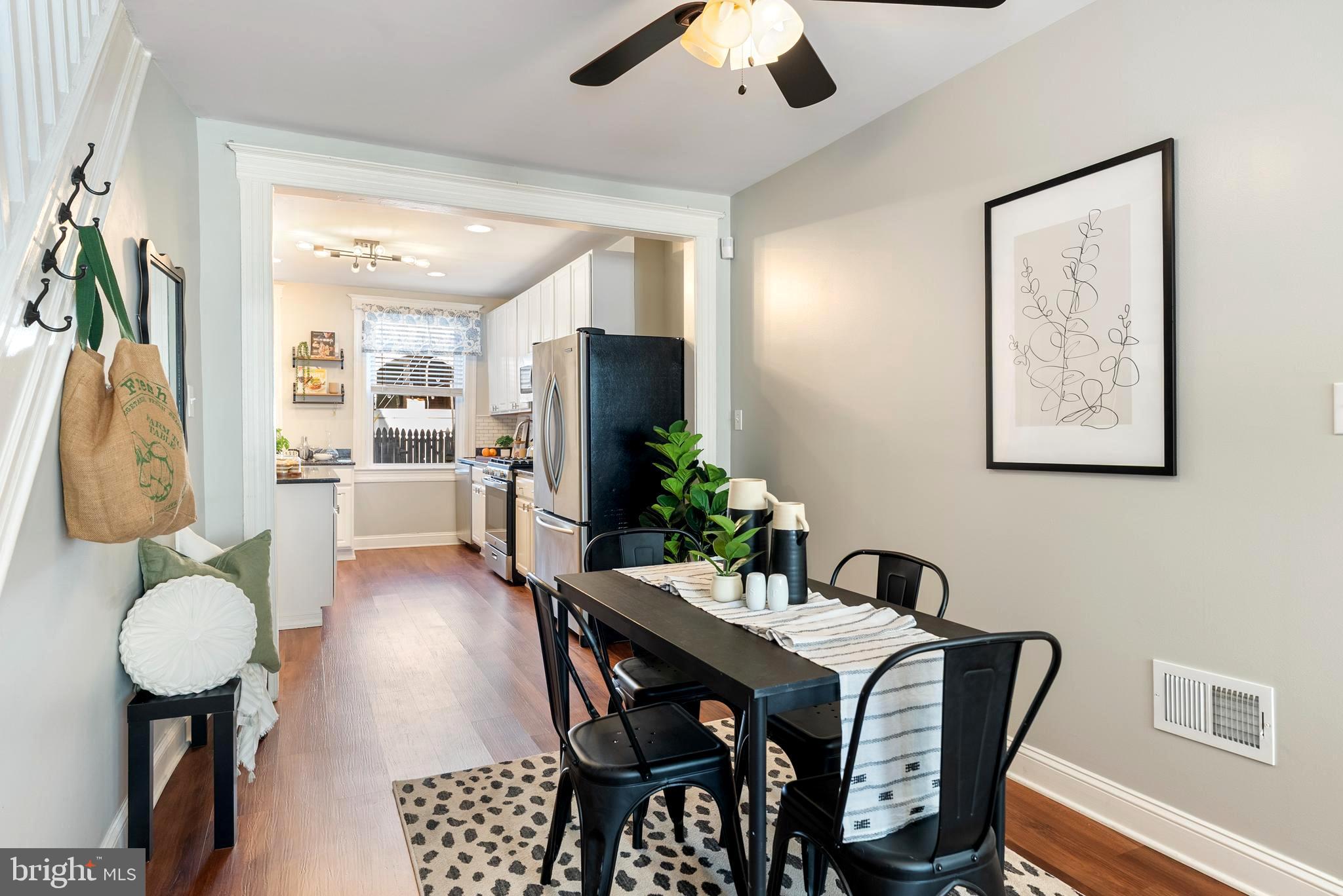 280 South Robinson Street Baltimore, MD 21224 - Photo 9 of 40 a view of a dining room with furniture and a potted plant