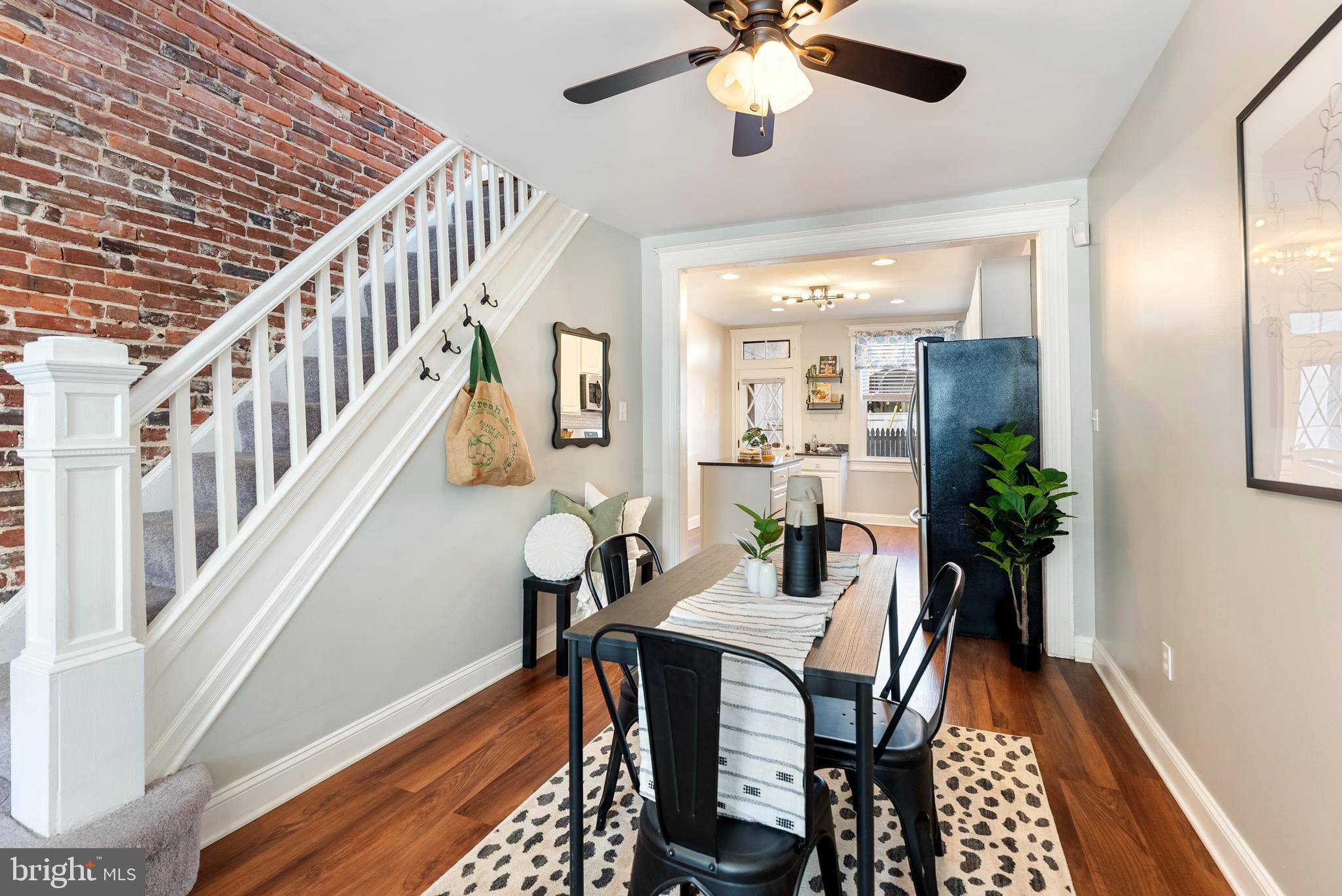 280 South Robinson Street Baltimore, MD 21224 - Photo 10 of 40 a view of a dining room with furniture and a chandelier
