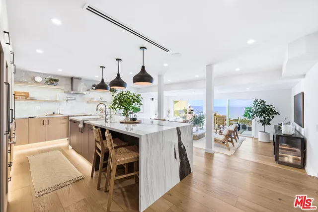 a kitchen with a table and chairs in it