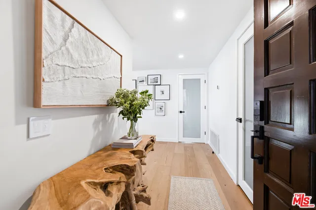 a bed room with a bed and a potted plant