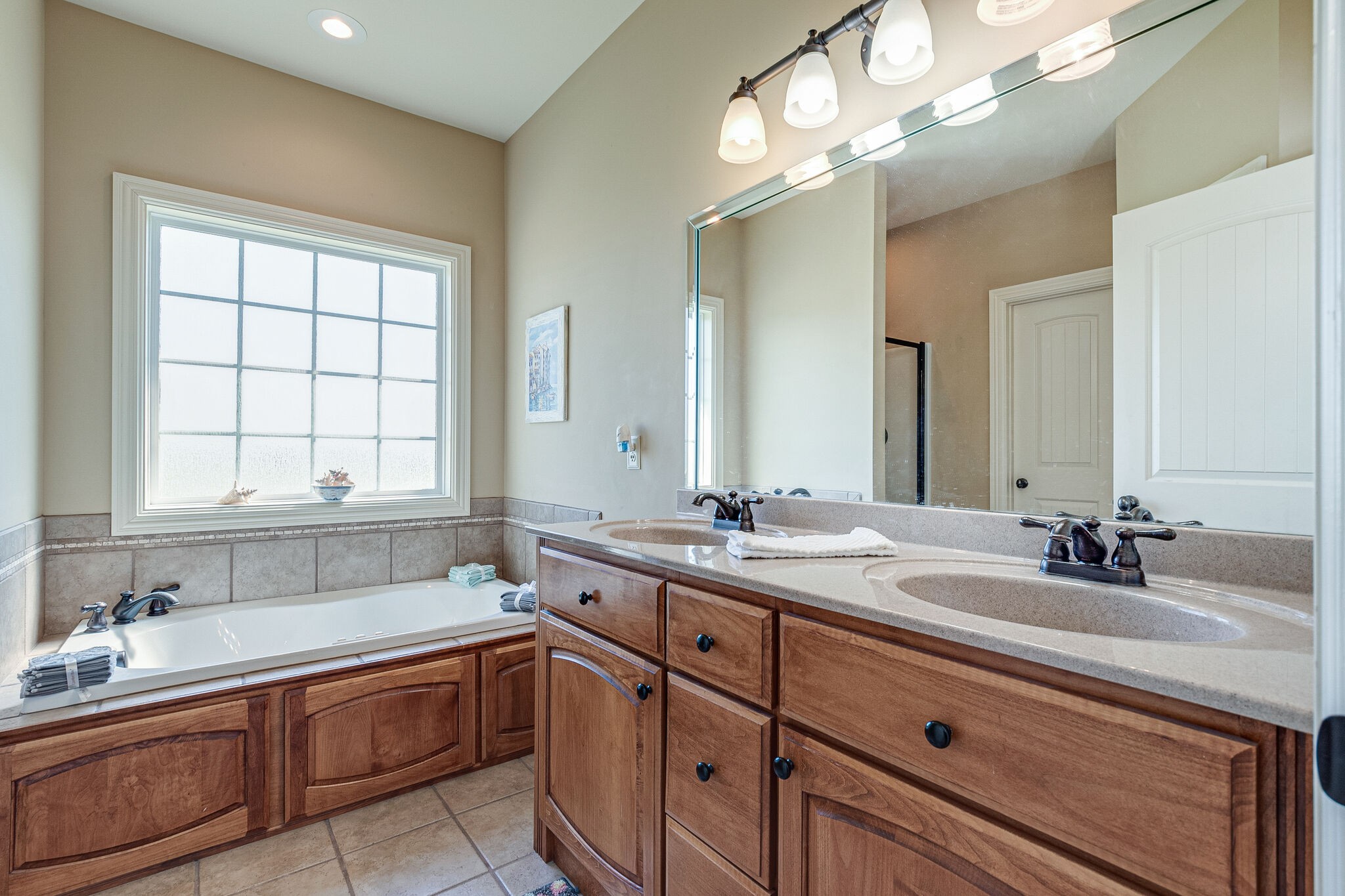 1586 Maxwell Branch Road Cottontown, TN 37048 - Photo 23 of 32 a bathroom with a sink double vanity and a mirror