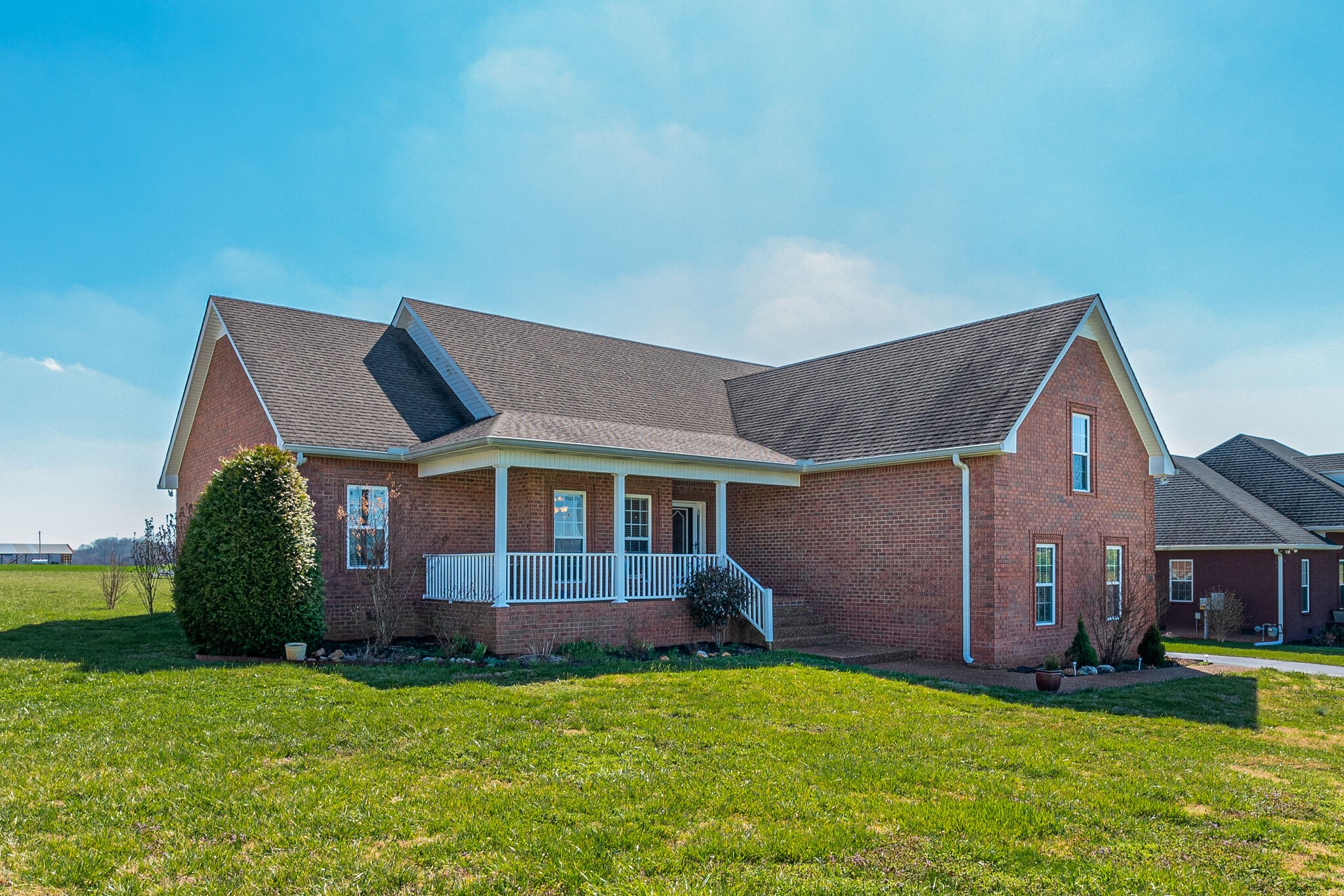 1586 Maxwell Branch Road Cottontown, TN 37048 - Photo 3 of 32 a front view of a house with a yard