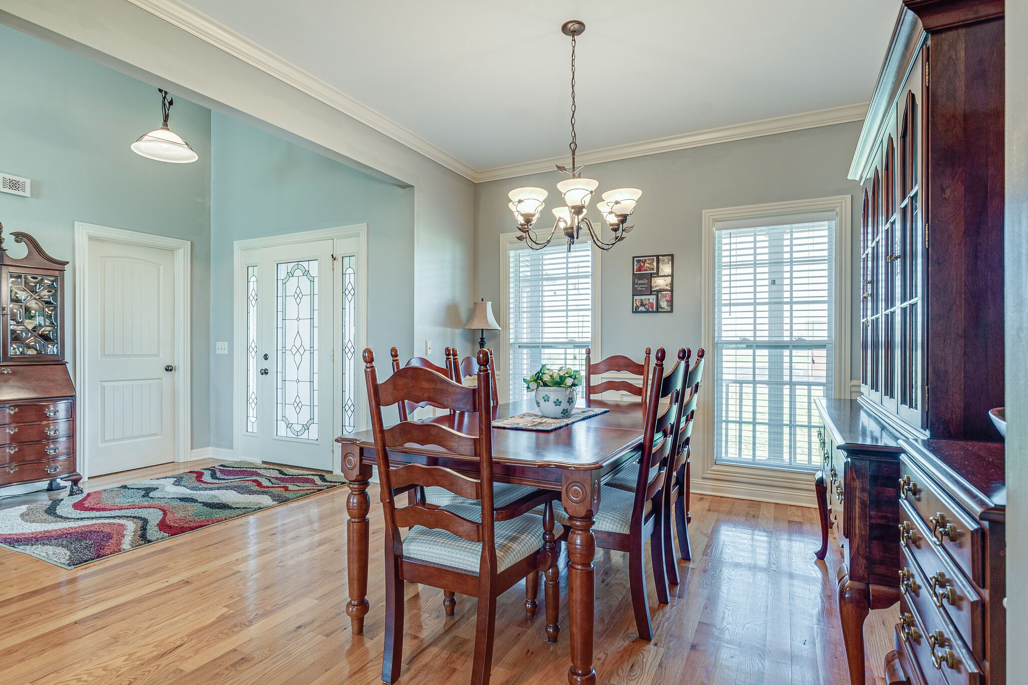 1586 Maxwell Branch Road Cottontown, TN 37048 - Photo 8 of 32 a view of a dining room with furniture a chandelier and wooden floor