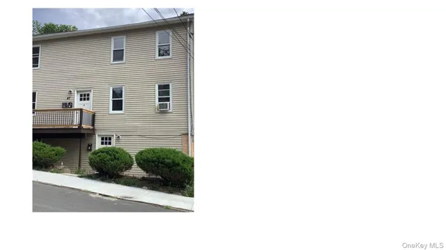 a picture of a house with a small yard