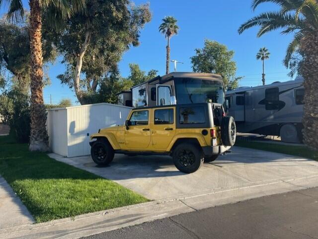 84136 Ave 44, Unit 59 Indio, CA 92203 - Photo 3 of 8 a view of a two chairs in the park