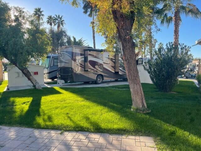 84136 Ave 44, Unit 59 Indio, CA 92203 - Photo 6 of 8 a view of a swimming pool with a yard