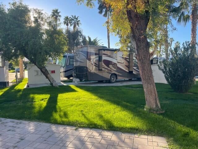 84136 Ave 44, Unit 59 Indio, CA 92203 - Photo 7 of 8 a view of a swimming pool with a yard