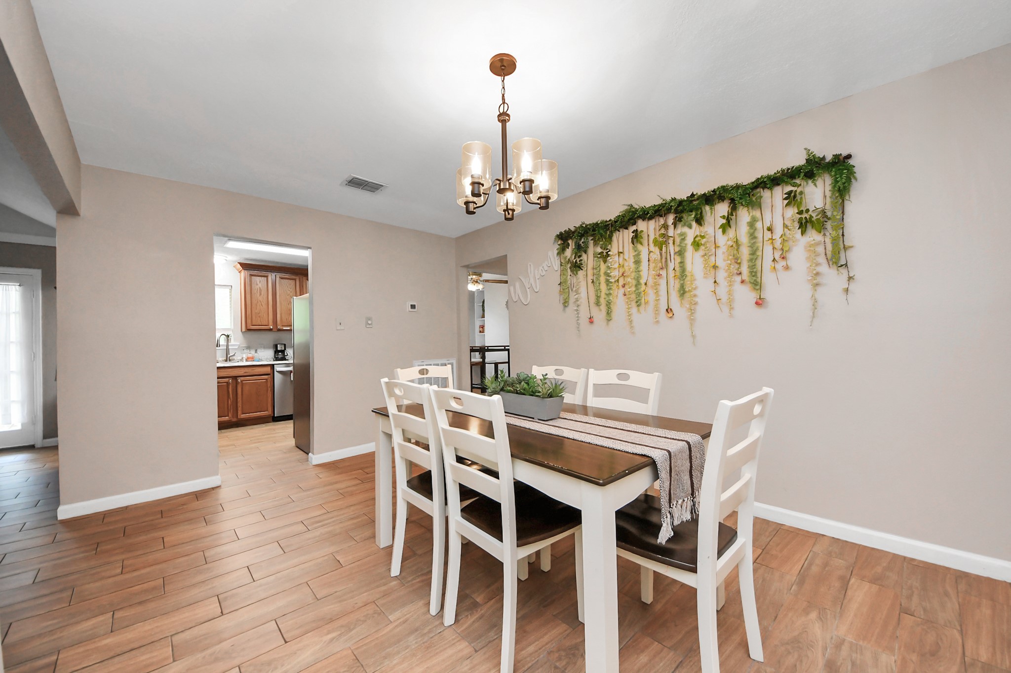 25803 Timber Lakes Drive Spring, TX 77380 - Photo 13 of 48 a view of a dining room with furniture window and wooden floor