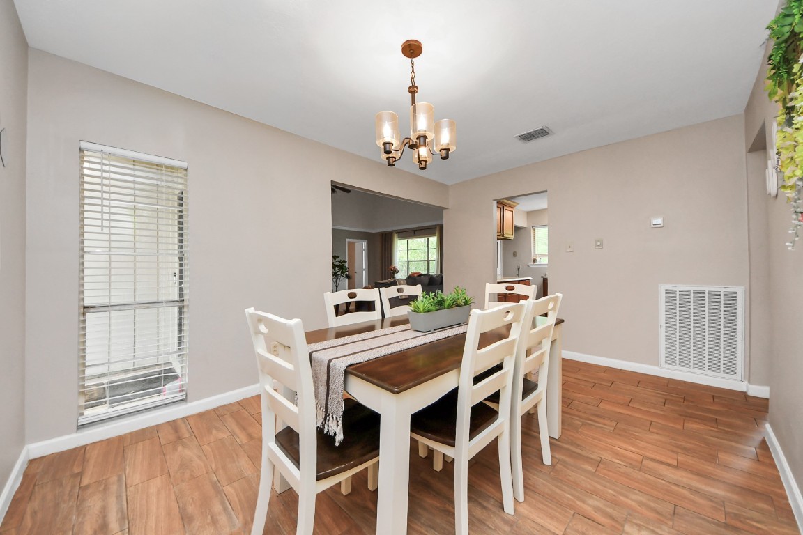 25803 Timber Lakes Drive Spring, TX 77380 - Photo 14 of 48 a view of a dining room with furniture window and wooden floor