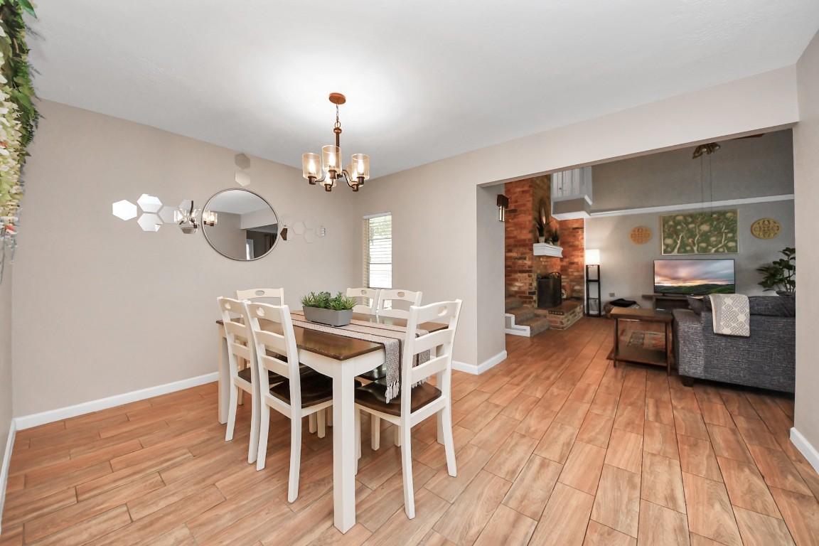 25803 Timber Lakes Drive Spring, TX 77380 - Photo 15 of 48 a view of a dining room with furniture and wooden floor