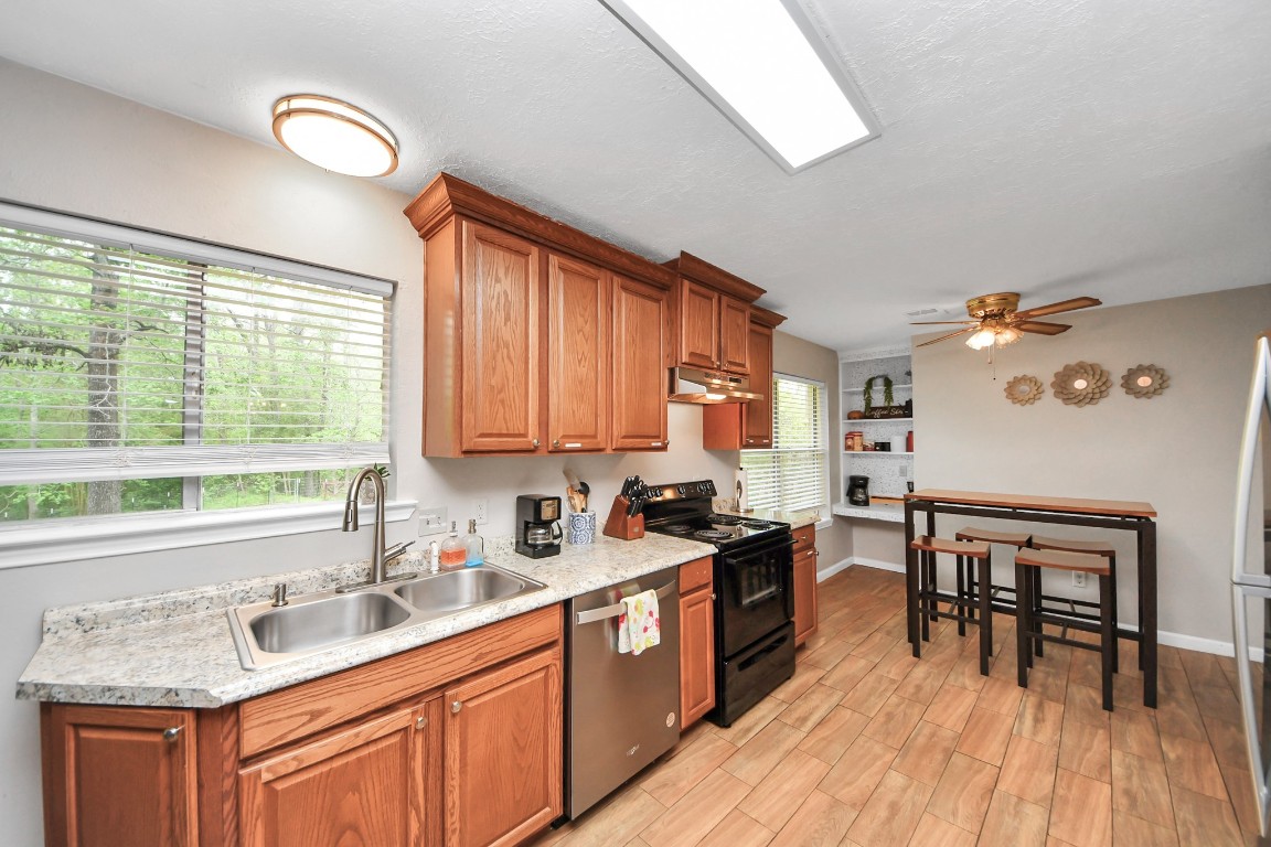 25803 Timber Lakes Drive Spring, TX 77380 - Photo 18 of 48 a kitchen with a sink a counter top space and appliances