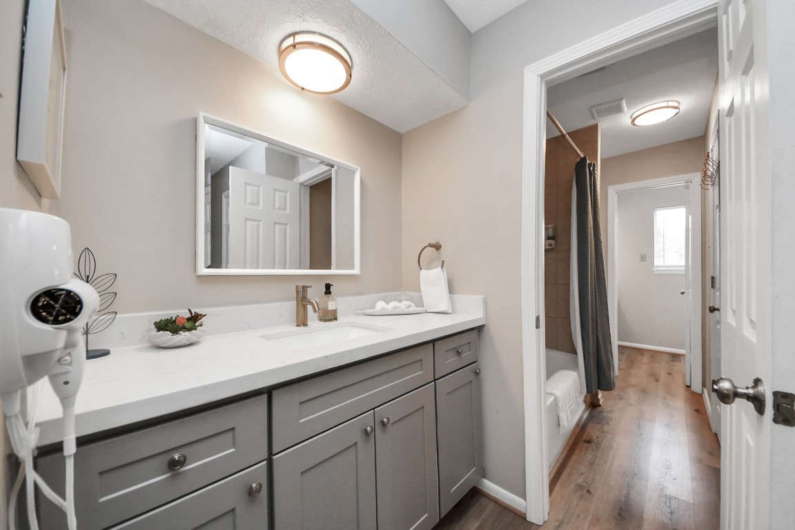 25803 Timber Lakes Drive Spring, TX 77380 - Photo 33 of 48 a en suite bathroom with a sink and a mirror