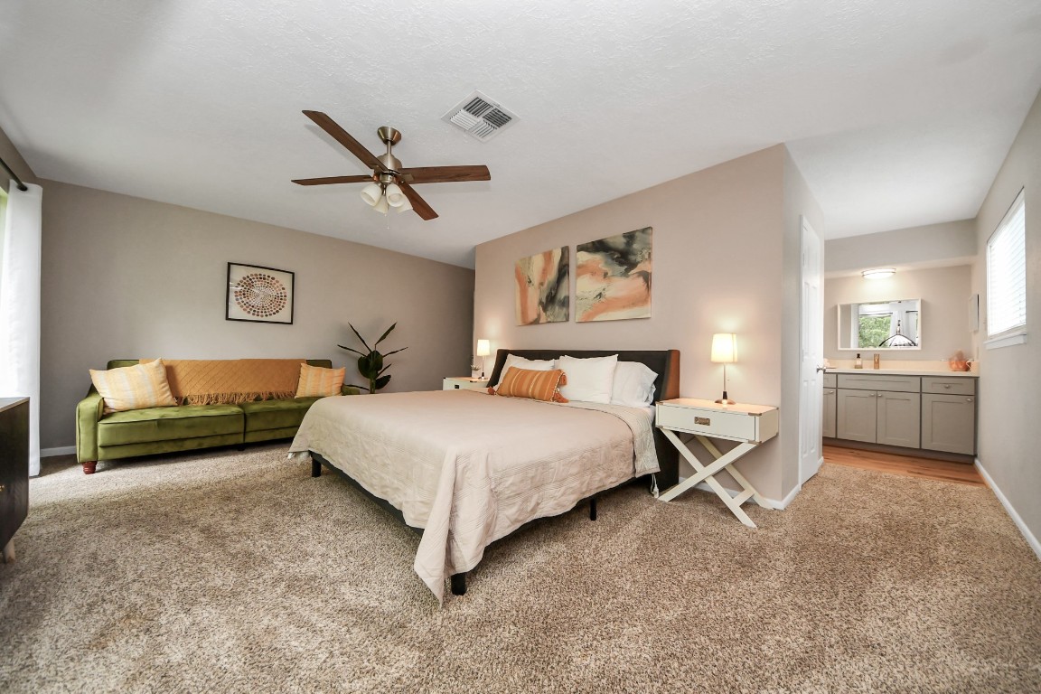 25803 Timber Lakes Drive Spring, TX 77380 - Photo 35 of 48 a bedroom with a bed and ceiling fan