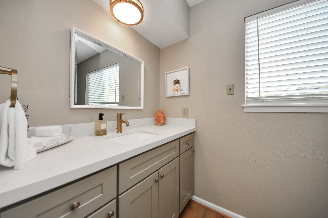 25803 Timber Lakes Drive Spring, TX 77380 - Photo 39 of 48 a bathroom with a sink and a mirror