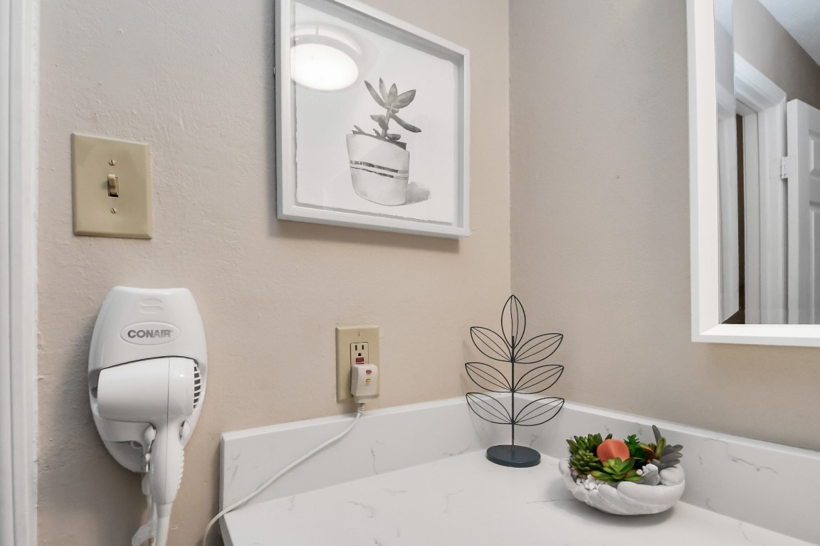 25803 Timber Lakes Drive Spring, TX 77380 - Photo 40 of 48 a bathroom with a toilet sink and mirror