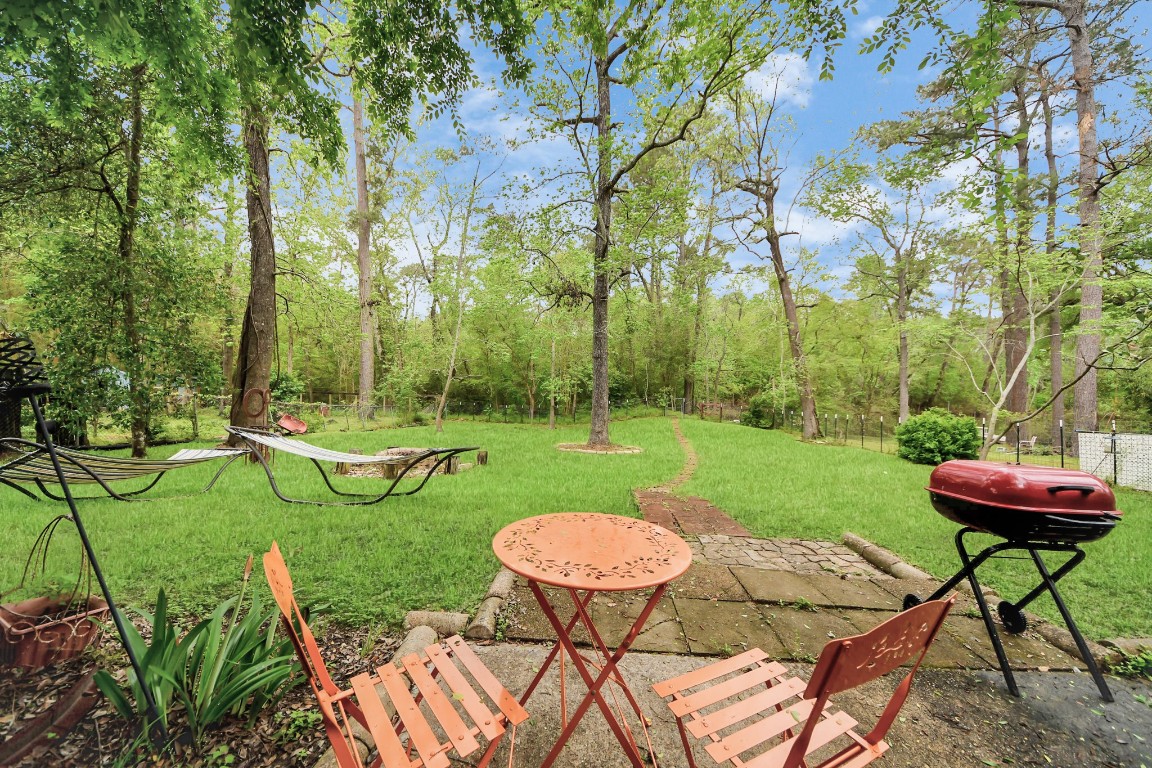 25803 Timber Lakes Drive Spring, TX 77380 - Photo 43 of 48 a view of a table and chairs in the garden