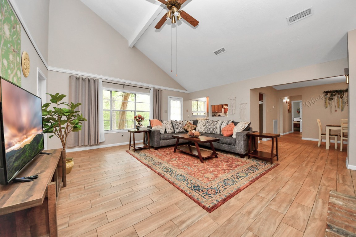 25803 Timber Lakes Drive Spring, TX 77380 - Photo 8 of 48 a living room with furniture and a flat screen tv