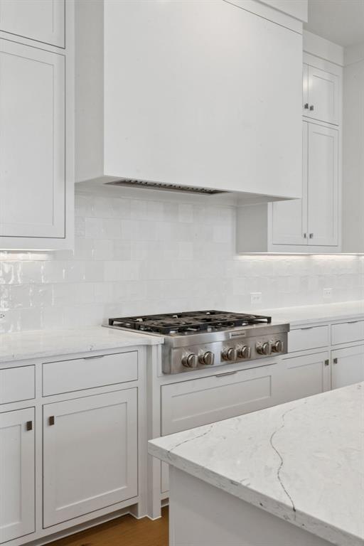 2124 Wakefield Lane Allen, TX 75013 - Photo 4 of 18 a white kitchen with granite countertop white cabinets and white appliances
