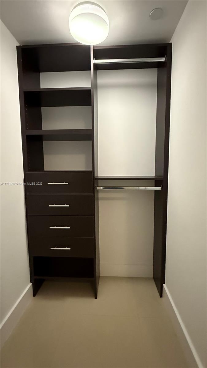 6000 Collins Avenue, Unit 323 Miami Beach, FL 33140 - Photo 16 of 35 a view of an empty walk in closet