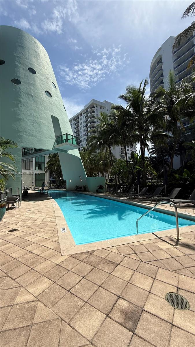 6000 Collins Avenue, Unit 323 Miami Beach, FL 33140 - Photo 28 of 35 a view of outdoor space tennis court