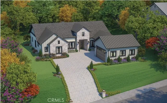 a aerial view of a house with a garden and yard