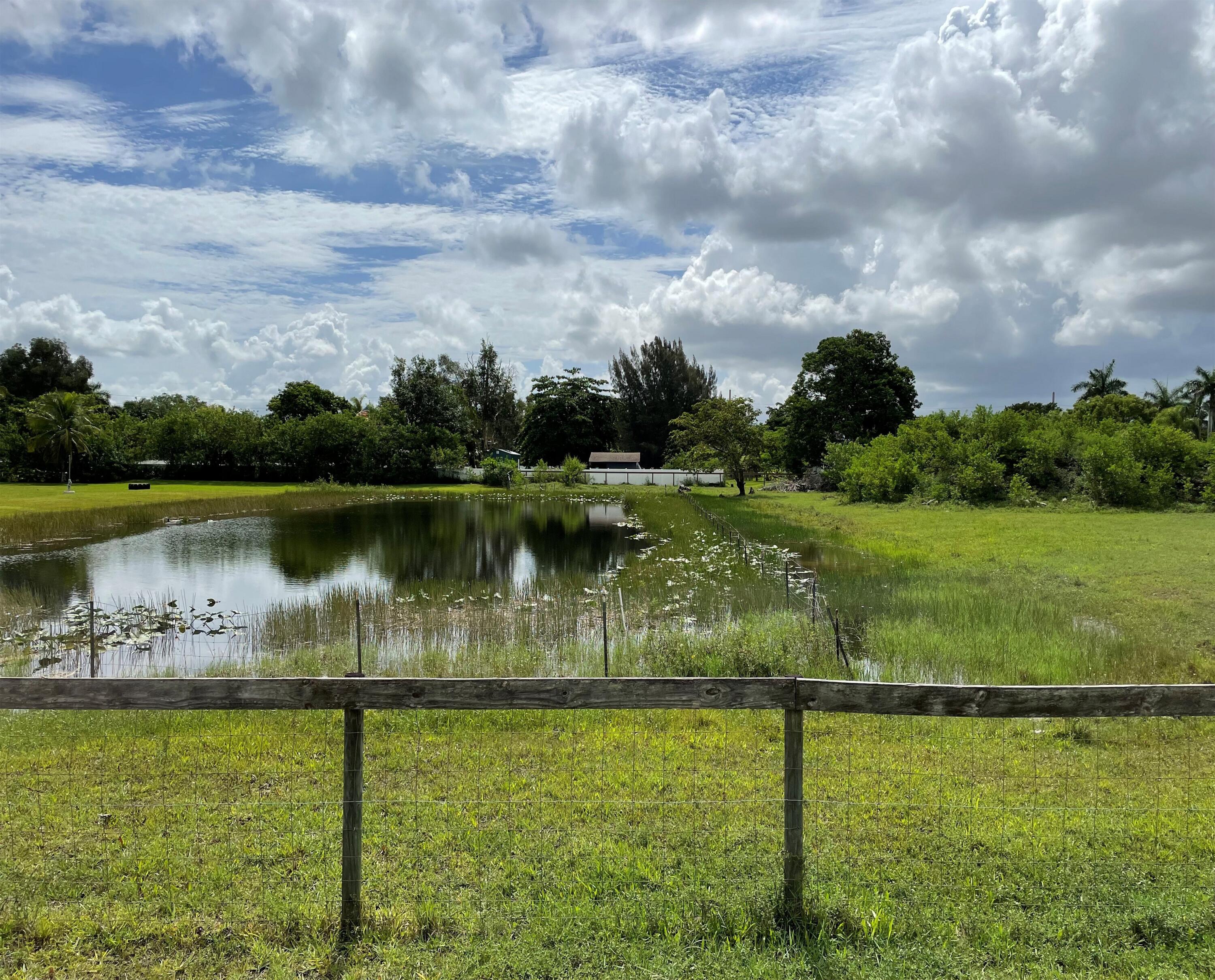 5650 Southwest 192nd Terrace Southwest Ranches, FL 33332 - Photo 3 of 29 a view of a lake from a yard