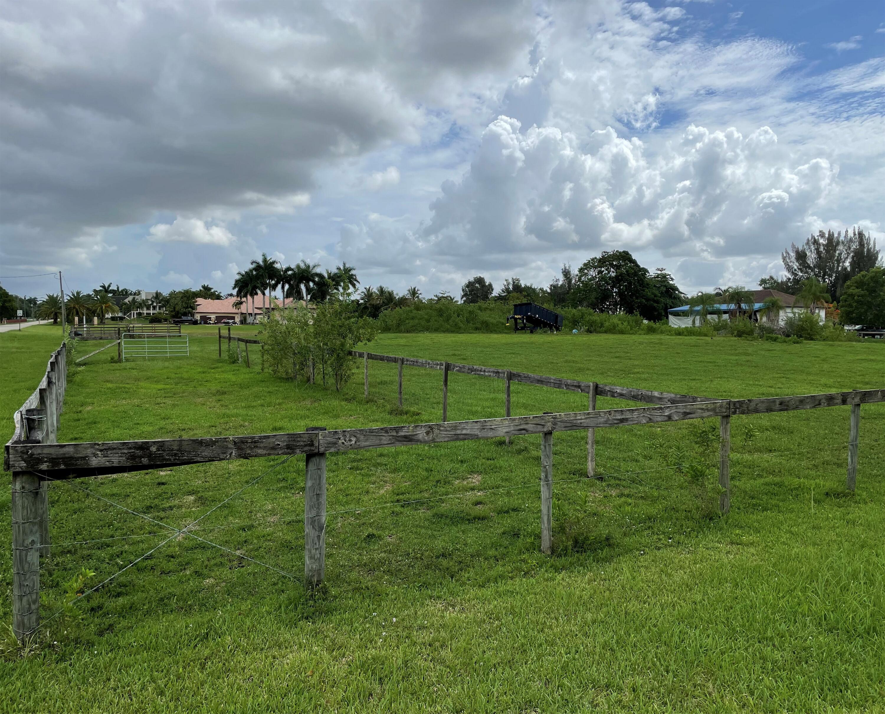 5650 Southwest 192nd Terrace Southwest Ranches, FL 33332 - Photo 5 of 29 a view of a golf course with a lake