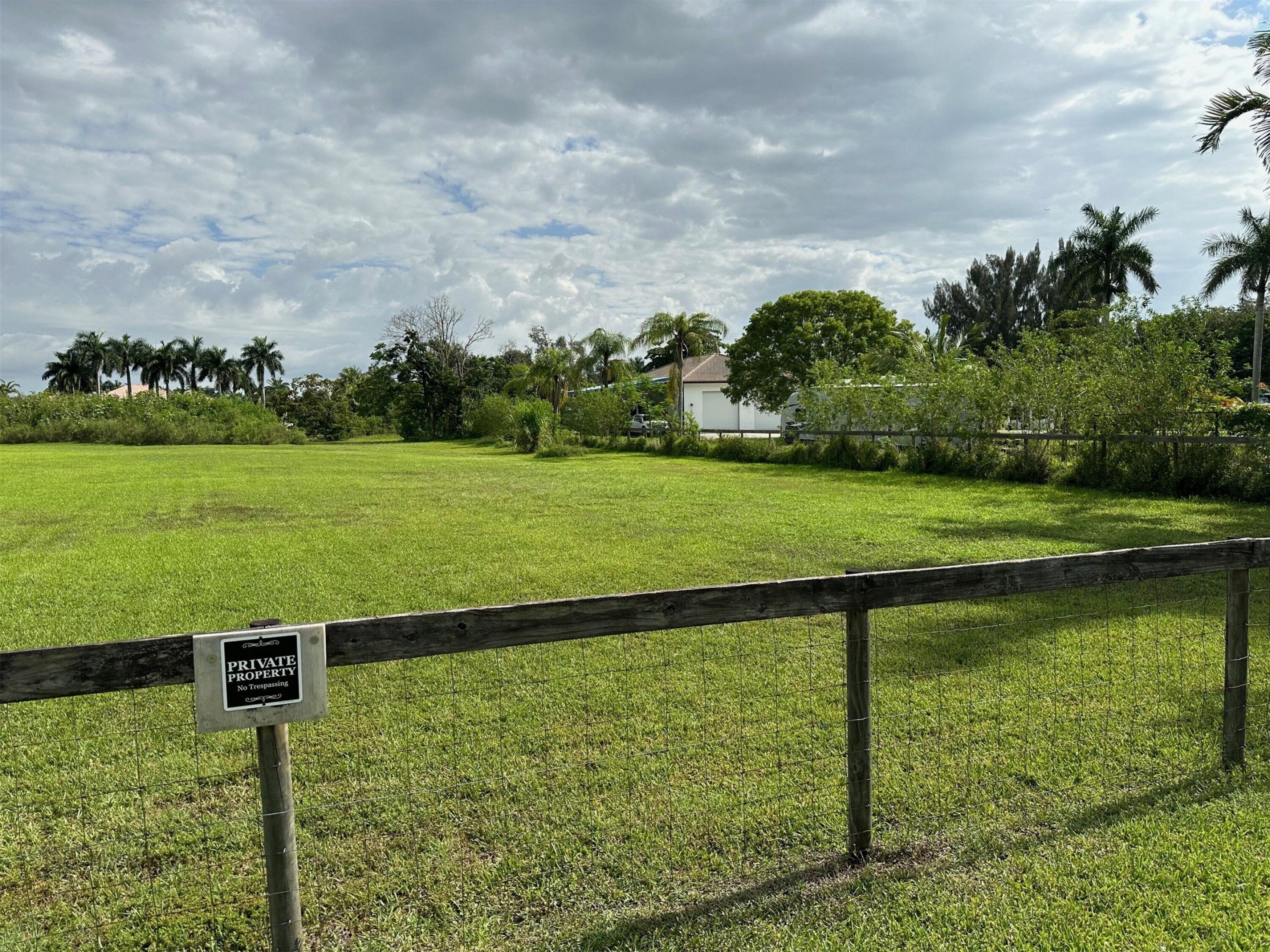 5650 Southwest 192nd Terrace Southwest Ranches, FL 33332 - Photo 7 of 29 a view of a golf course with a lake view