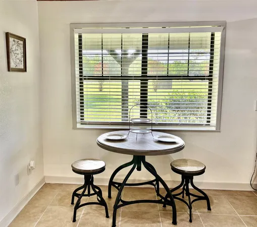 a view of a table and chairs in a room