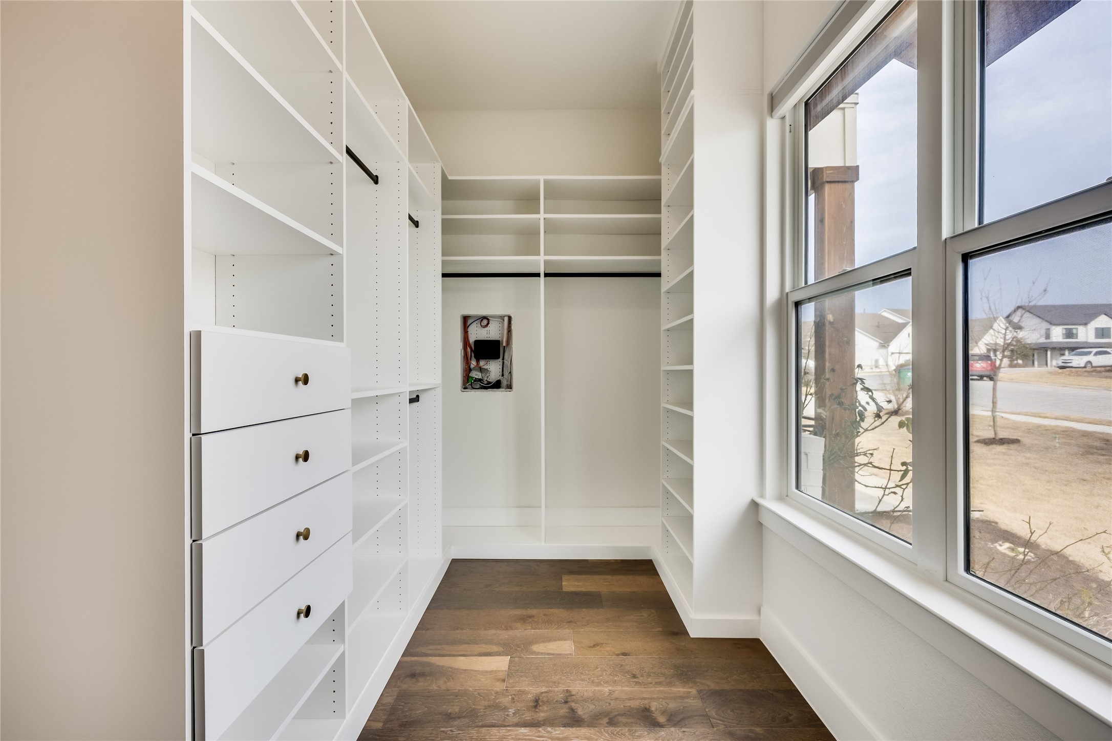 288 Smoke Tree Circle Dripping Springs, TX 78620 - Photo 15 of 40 a view of walk in closet with empty racks