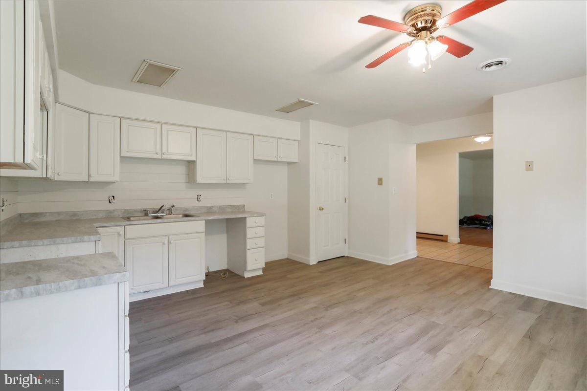 246 Poets Lane Inwood, WV 25428 - Photo 20 of 32 a view of a kitchen with a sink and cabinets