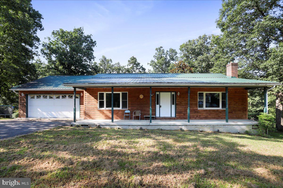 246 Poets Lane Inwood, WV 25428 - Photo 2 of 32 a house view with a seating space