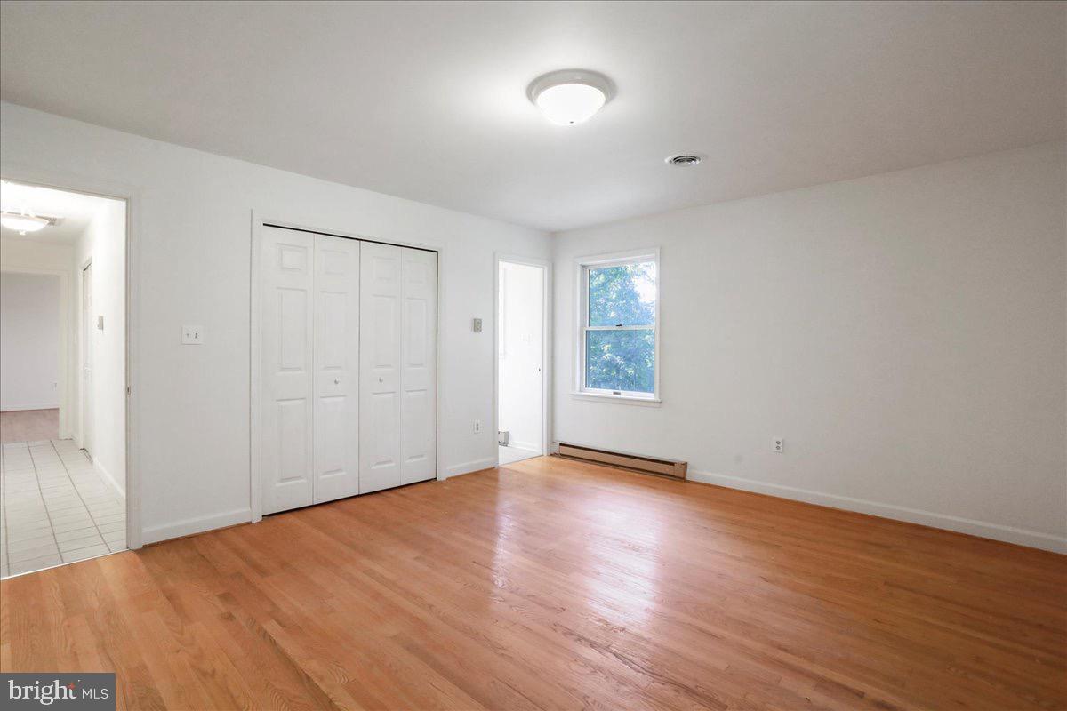 246 Poets Lane Inwood, WV 25428 - Photo 28 of 32 a view of an empty room with wooden floor and a window