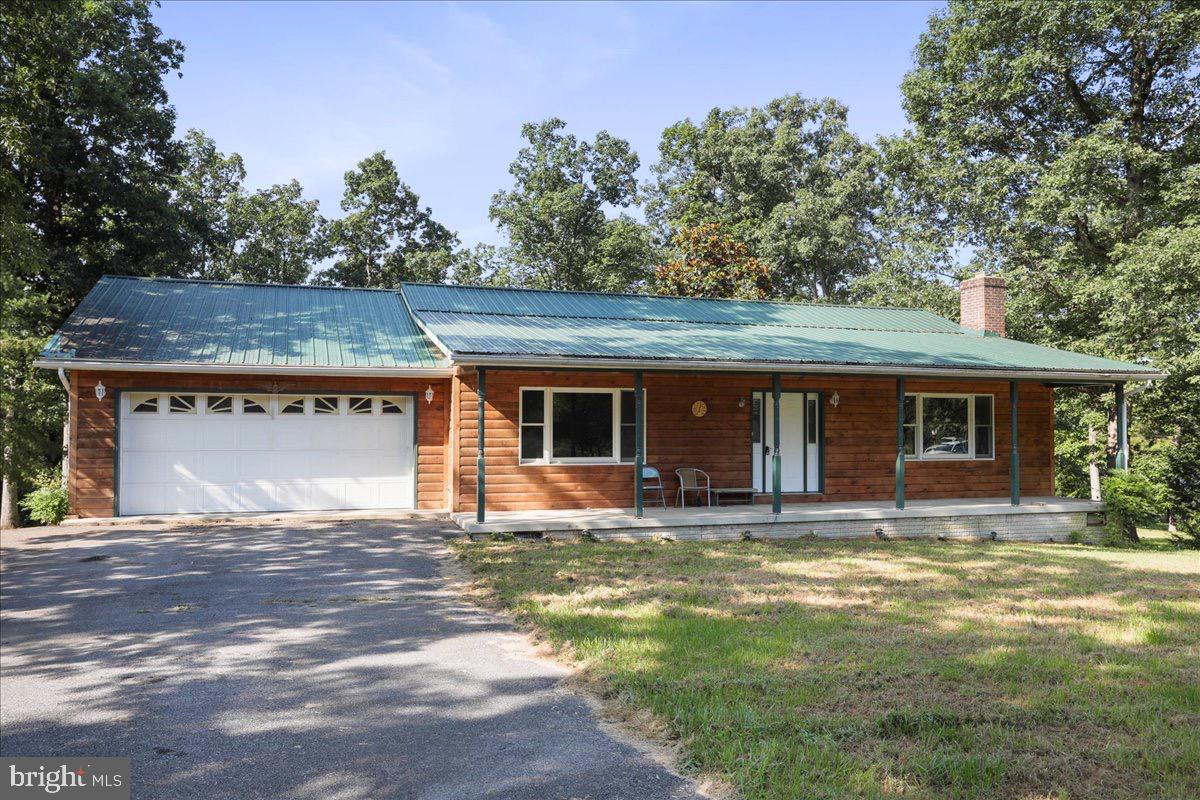 246 Poets Lane Inwood, WV 25428 - Photo 6 of 32 a house view with a sitting space and garden space
