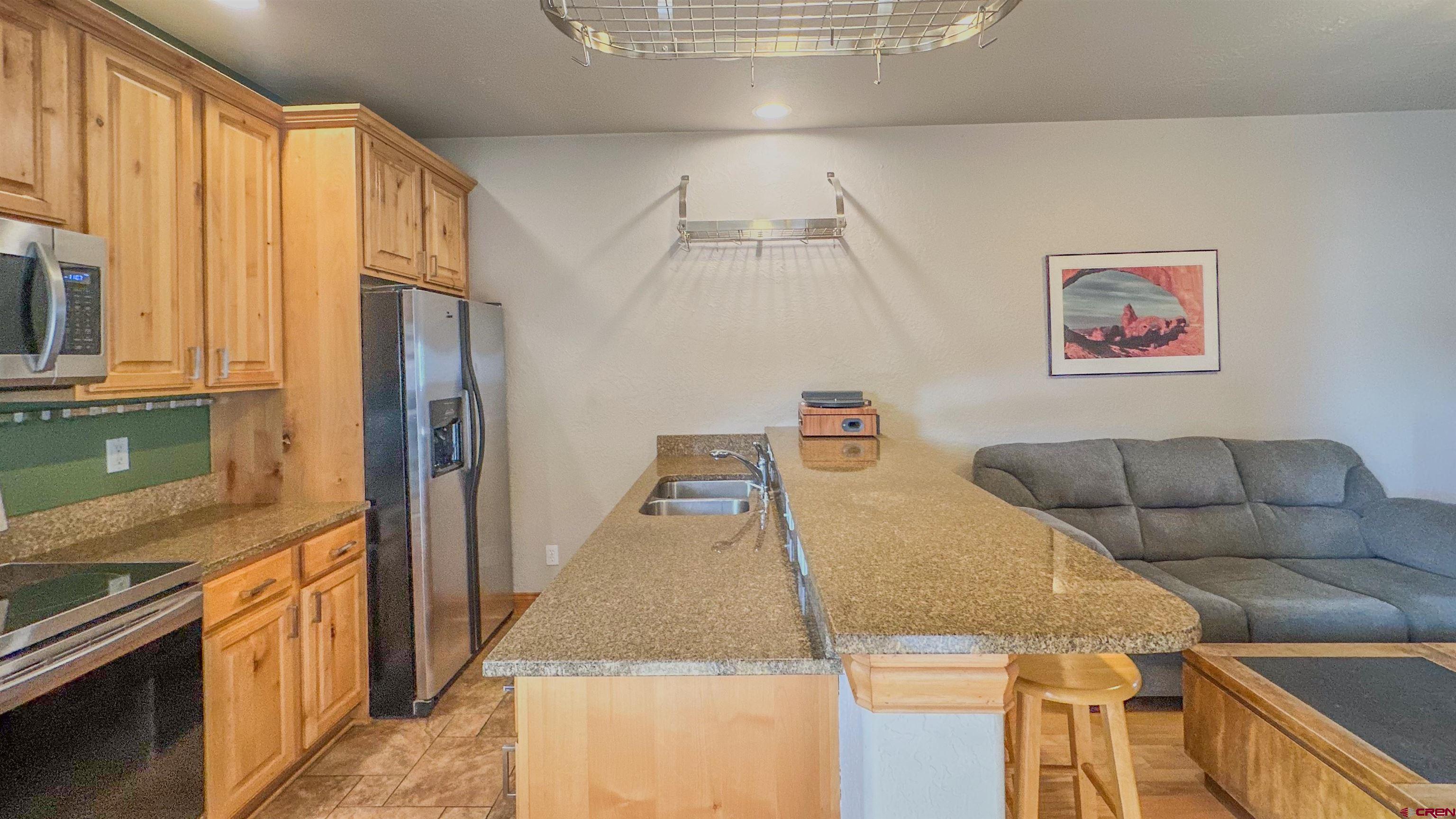2855 Main Avenue, Unit A 209 Durango, CO 81301 - Photo 12 of 20 a living room with furniture and a kitchen