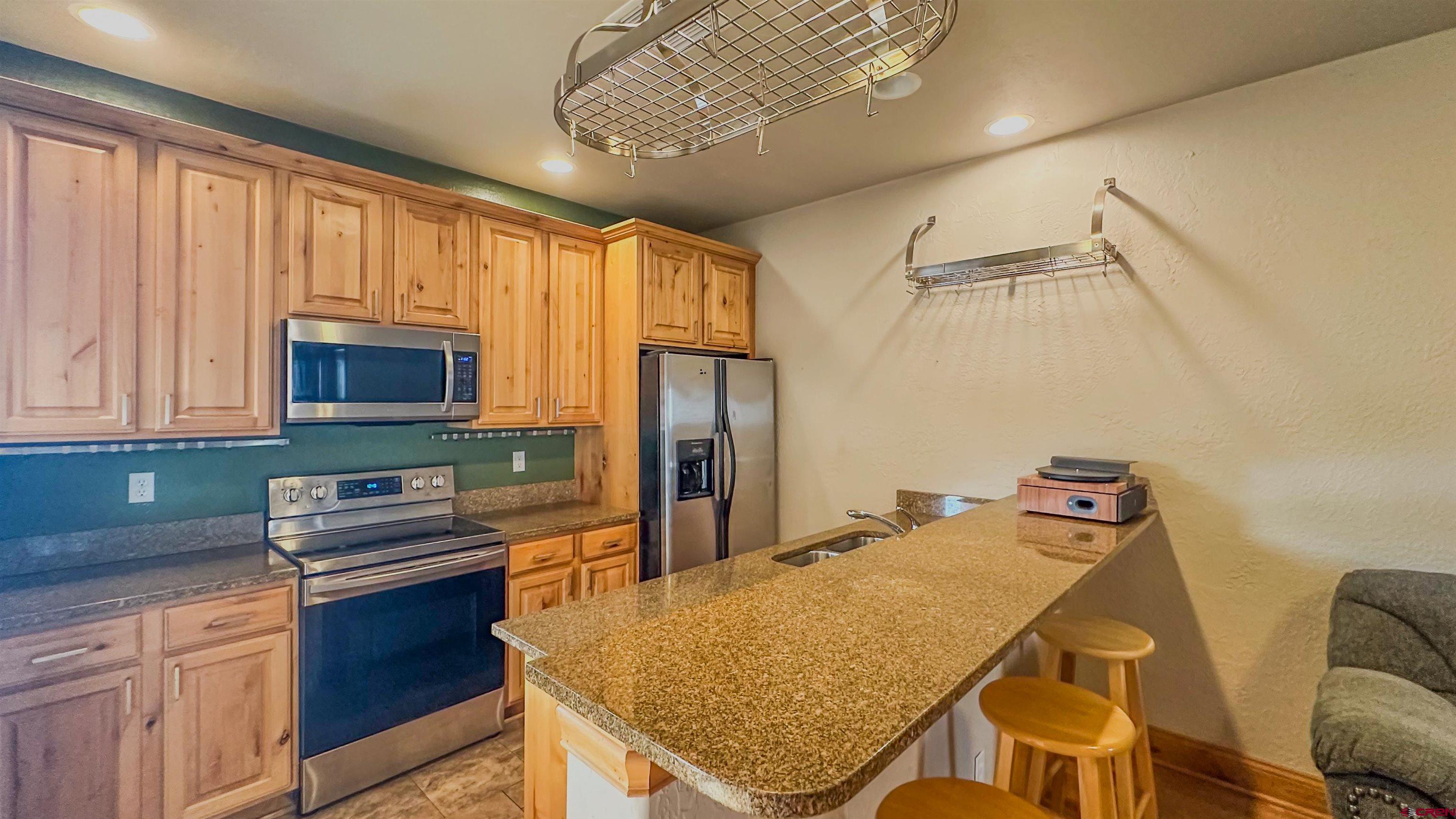 2855 Main Avenue, Unit A 209 Durango, CO 81301 - Photo 8 of 20 a kitchen that has a cabinets and appliances