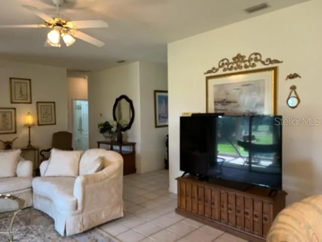 a living room with furniture and a rug