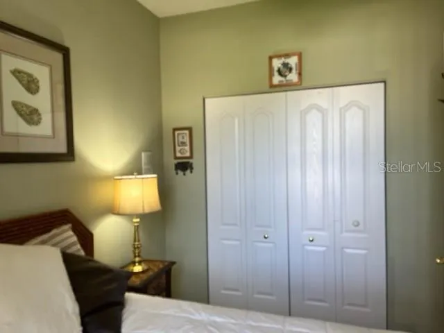 a bathroom with a sink vanity mirror and toilet