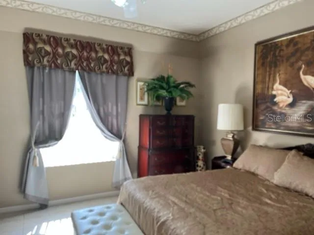 a living room with furniture and a mirror