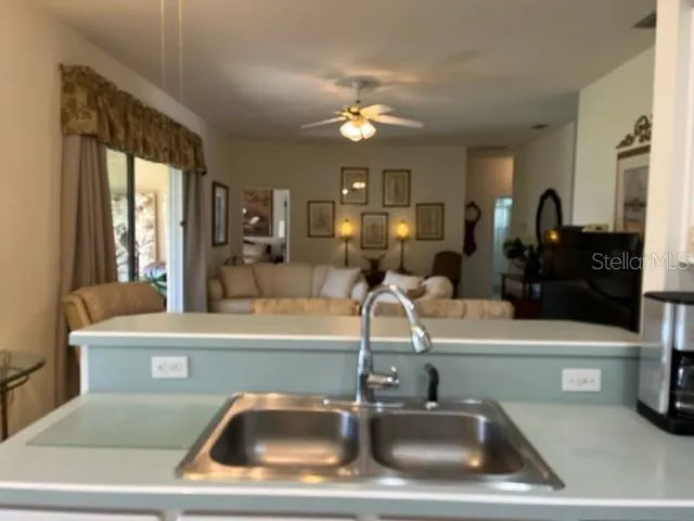 a kitchen with stainless steel appliances granite countertop a sink and cabinets