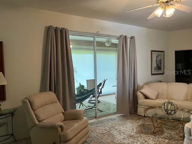 a living room with furniture or couch and a window